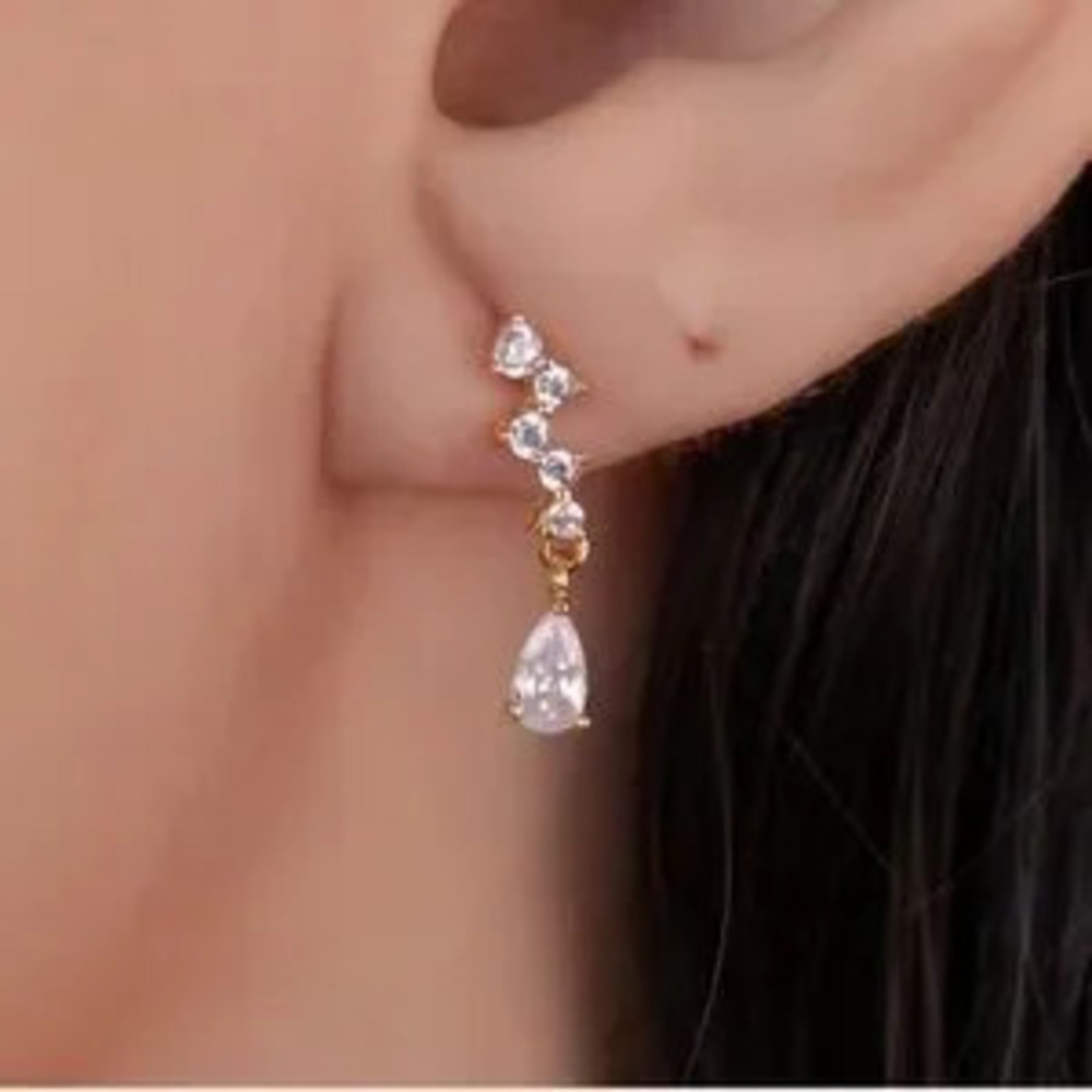 Zara 925 sterling silver dangle earrings with pear sharped CZ
